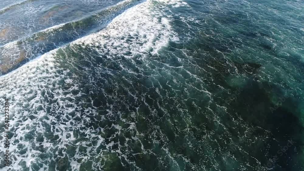 Aerial bird view of calm ocean waves running over surface the sea contains salty water that covers more then 70 percent of Earth and moderates climate and has roles in carbon and nitrogen cycle 4k Aerial bird view of calm ocean waves running over surface the sea contains salty water that covers more then 70 percent of Earth and moderates climate and has roles in carbon and nitrogen cycle 4k