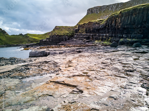 The coastline with the rare Dinosaur footprints of the sauropod-dominated tracksite from Rubha nam Brathairean, Brothers Point - Isle of Skye, Scotland photo