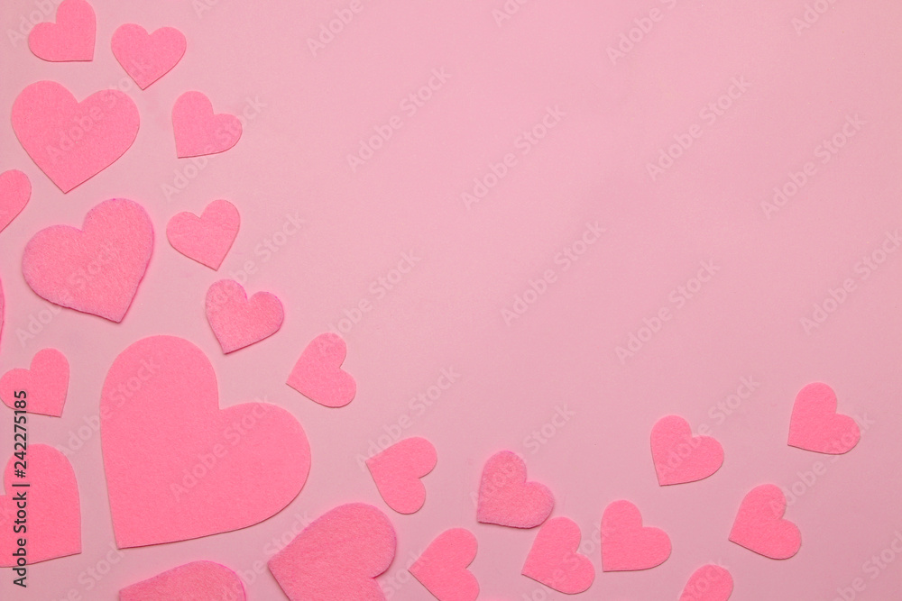 Pink hearts on a bright pink background. frame of hearts, top view with space for text