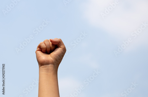 Woman arm with fist raised in the air.