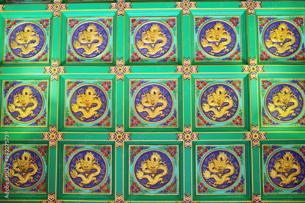 Rows of golden Dragon Statues on the wall, Golden Dragon Chinese style pattern row for background 