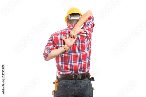 Constructor stretching with hands behind back.
