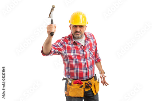 Builder threatening to hit with hammer.