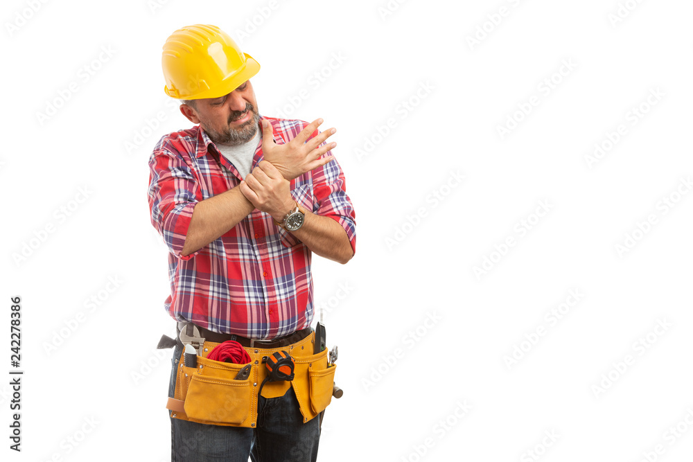 Builder checking sprained wrist.