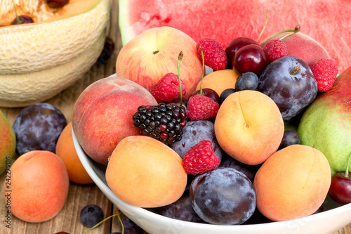 Healthy food  vegetarian diet - fresh organic fruit in bowl on table