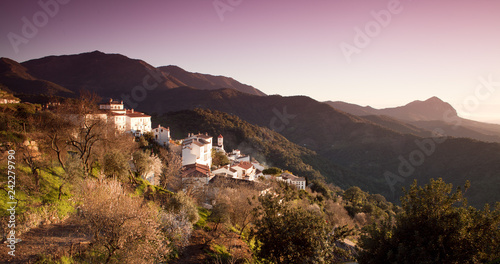  Grazalmea and Nieves  Mountains in Spain with small white village  -  Genalguacil