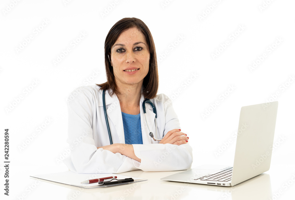 Female doctor working on medical expertise and searching information on laptop at hospital office