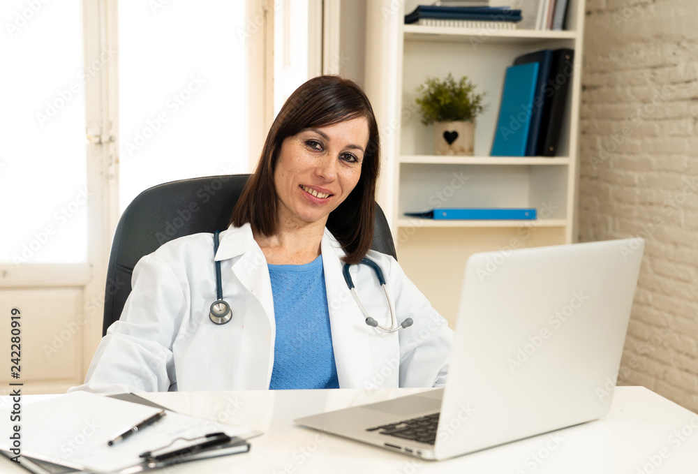 Female doctor working on medical expertise and searching information on laptop at hospital office Female doctor working on medical expertise and searching information on laptop at hospital office