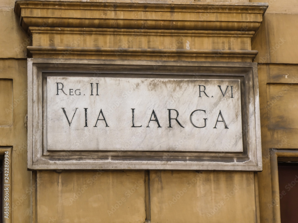 Street name sign of Via Larga in Rome, Italy, historical street close to Piazza Navona Street name sign of Via Larga in Rome, Italy, historical street close to Piazza Navona