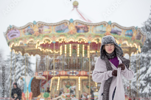 Outdoors lifestyle portrait of stunning girl walking on the holiday city