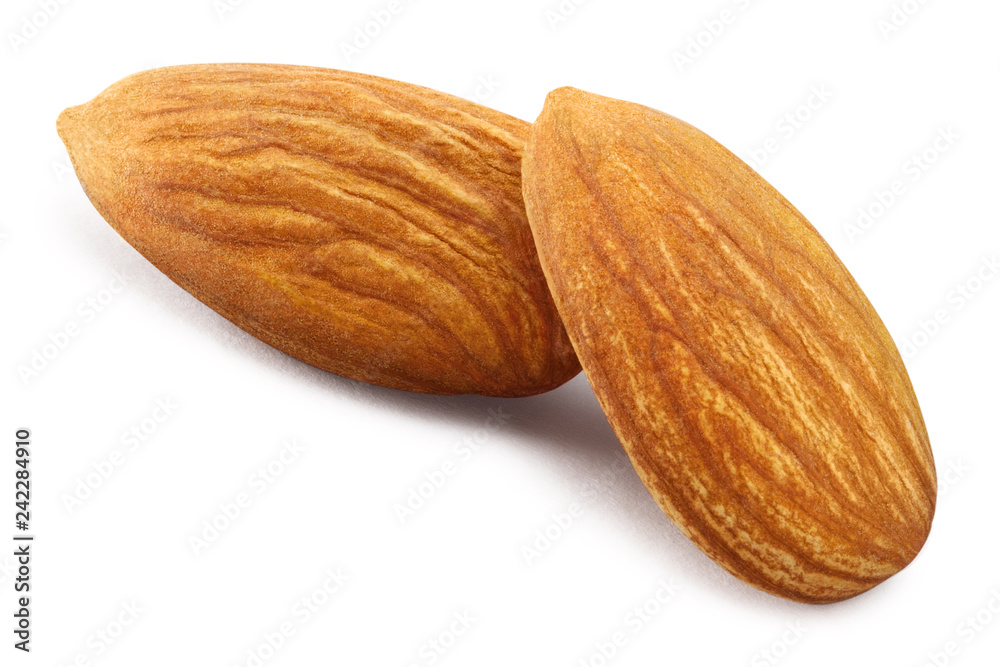 Close-up of two almonds, isolated on white background