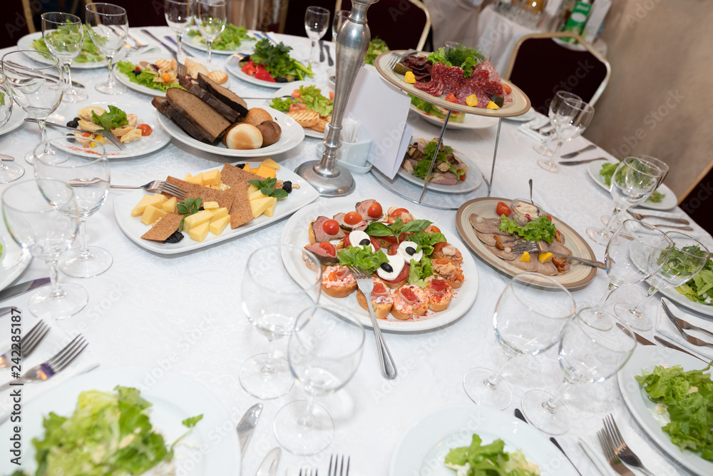 Fototapeta premium holiday table with various dishes, snacks, drinks