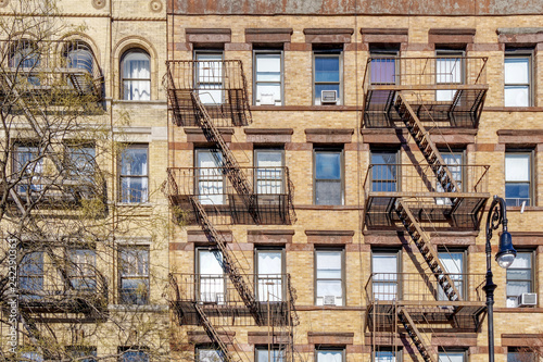 New-York building facades with fire escape stairs © Guy