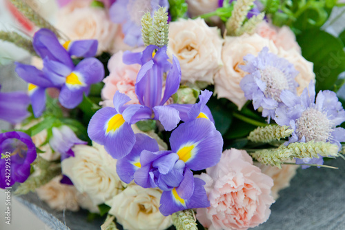 Fototapeta Naklejka Na Ścianę i Meble -  Purple irises and other flowers in the bouquet.