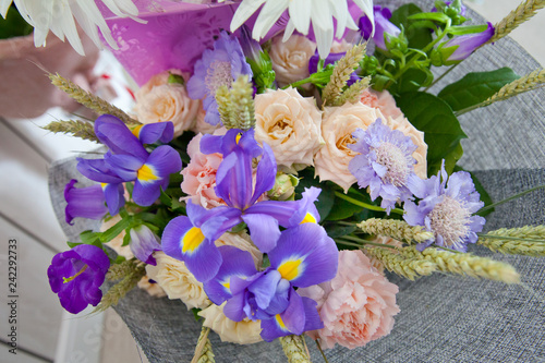 Fototapeta Naklejka Na Ścianę i Meble -  Purple irises and other flowers in the bouquet.