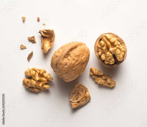a whole walnut, an open walnut and other pieces
