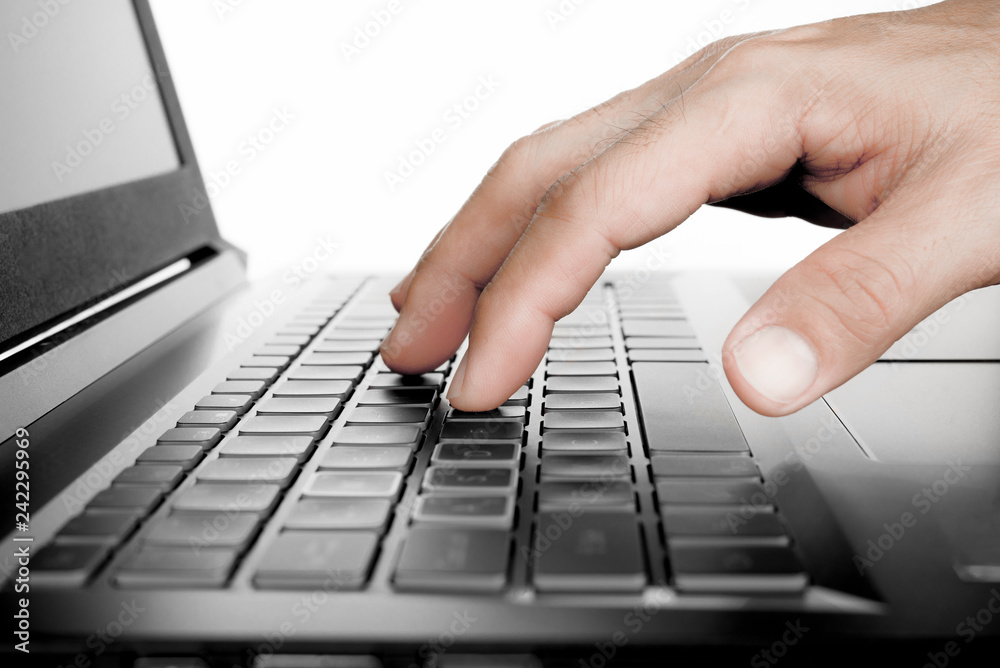 Hand with computer notebook , man working or hacker stealing password from laptop Hand with computer notebook , man working or hacker stealing password from laptop