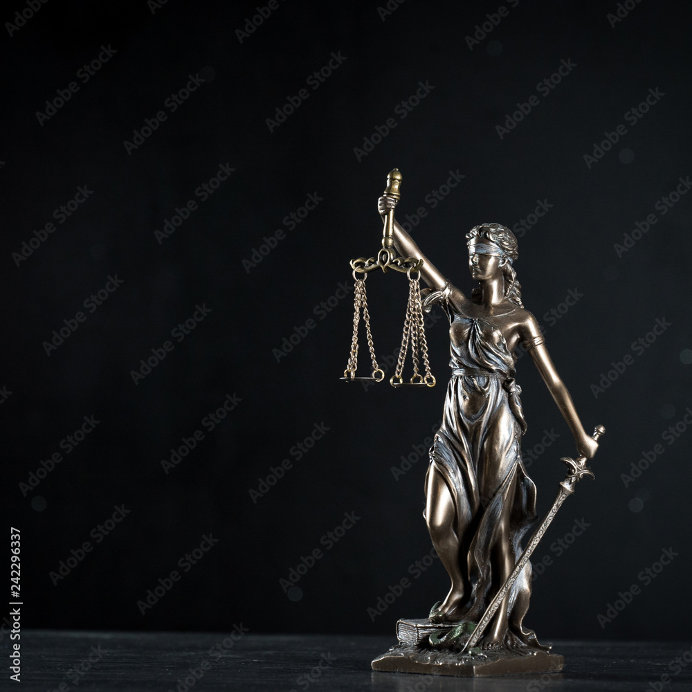 Goddess of justice on a beautiful black background. the subject of law Goddess of justice on a beautiful black background. the subject of law