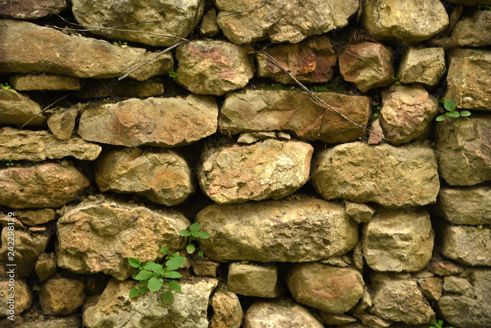 Decorative wall of stones in the mountains Decorative wall of stones in the mountains