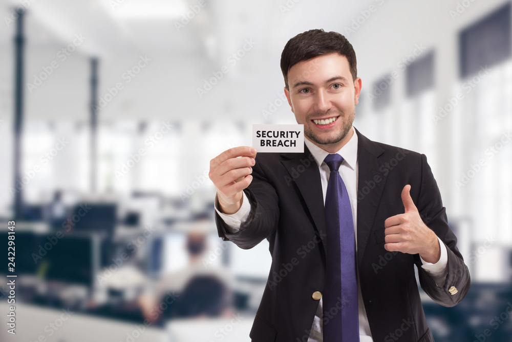 Business, technology, internet and networking concept. Young entrepreneur showing keyword: Security breach Business, technology, internet and networking concept. Young entrepreneur showing keyword: Security breach