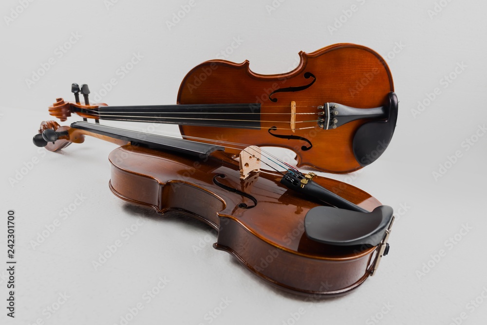 Fototapeta premium Violin and viola put on white background,During the practice break time to prepare For the concert.