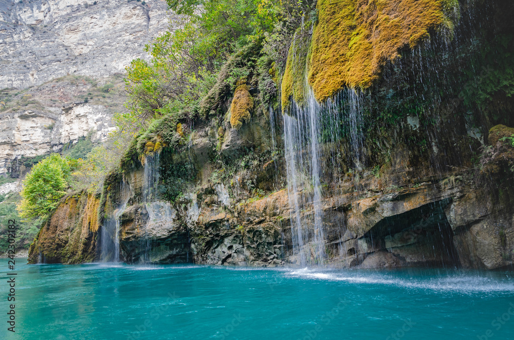 Naklejka premium canyon with blue river and waterfalls