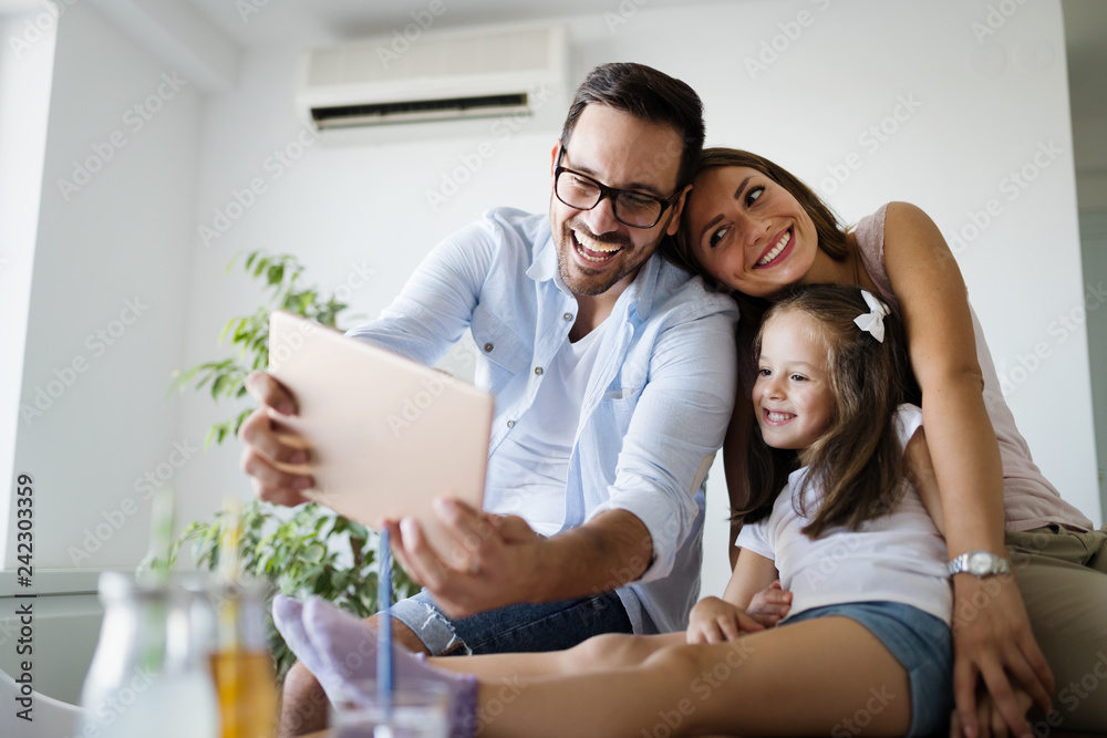 Happy family having fun time at home Happy family having fun time at home
