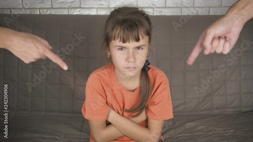 Raising a teenager. Sad teenager girl who is scolded by her parents. Problems in adolescence.