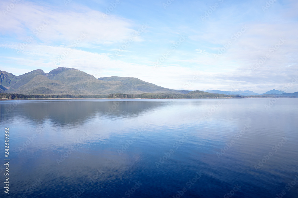 Beautiful Lake In Alaska Surrounded By Mountains And Forests