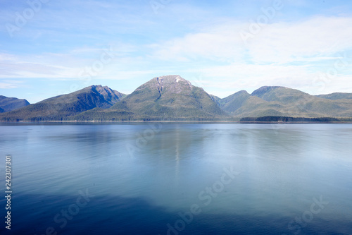 Beautiful Lake In Alaska Surrounded By Mountains And Forests