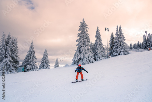 Snowboarder at sunset.