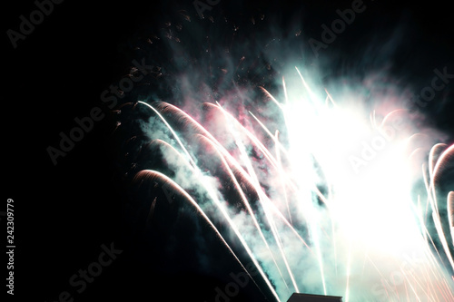 Live fireworks light up the sky with dazzling display.New Year celebration colorful fireworks. New year and holidays concept. - Image