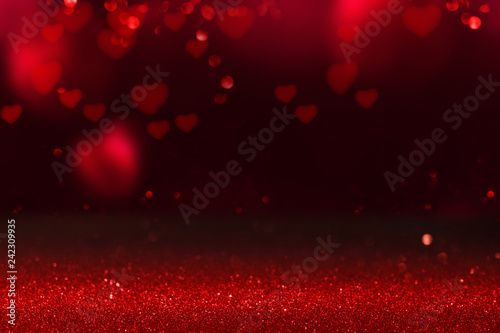 Red hearts on glittering background