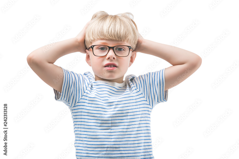 Funny kid posing on white background isolated. Close up portrait of little boy holding his head and hair. Adorable child thinking. Funny kid posing on white background isolated. Close up portrait of little boy holding his head and hair. Adorable child thinking.