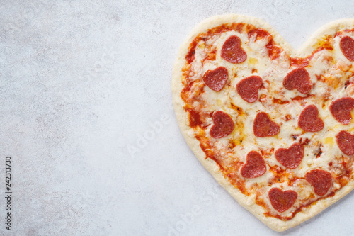 Baked heart shaped pepperoni pizza for Valentines Day.