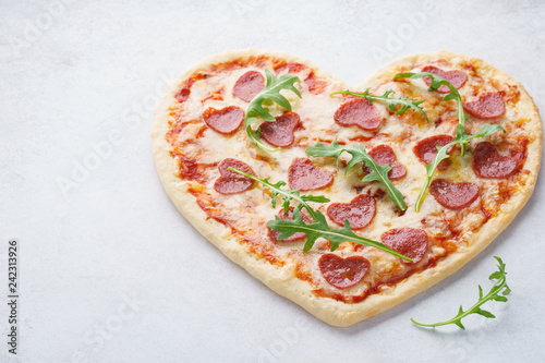 Heart shaped pizza with pepperoni. Valentines day romantic menu
