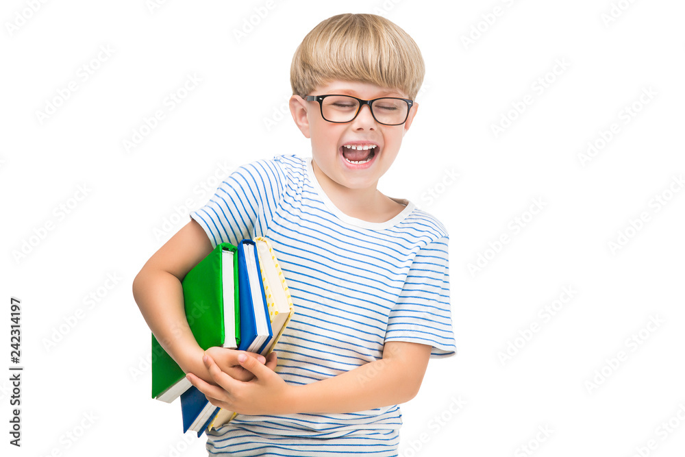 Cute little child with books and notebooks on isolated white background. Adorable kid reading. Schoolboy studio shot. Boy wearing eyeglasses. Cute little child with books and notebooks on isolated white background. Adorable kid reading. Schoolboy studio shot. Boy wearing eyeglasses.