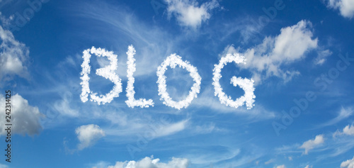BLOG inscription painted with clouds on a blue background with white clouds