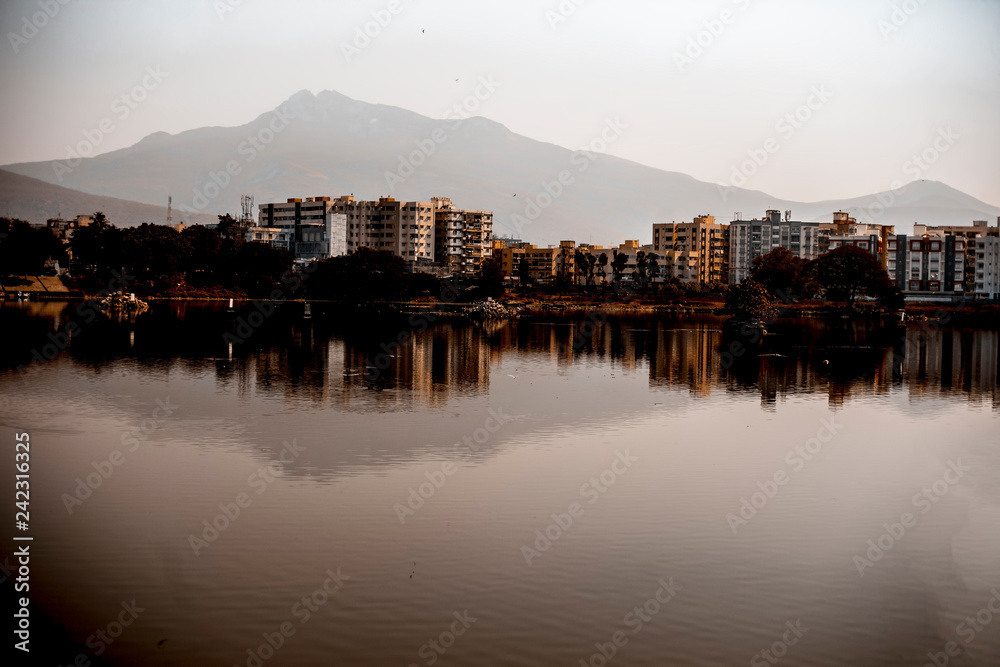 Landscape shot of mountains and lake water during daylight. Landscape shot of mountains and lake water during daylight.