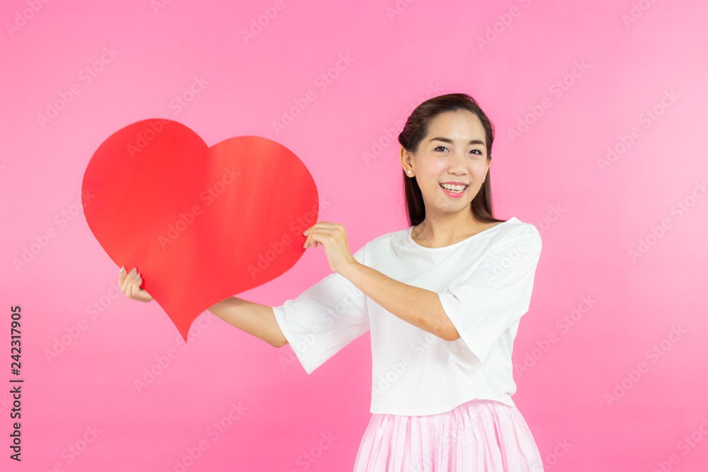 valentine day concept. Beautiful smiley asia girl with pink background copy space isolated. valentine day concept. Beautiful smiley asia girl with pink background copy space isolated.