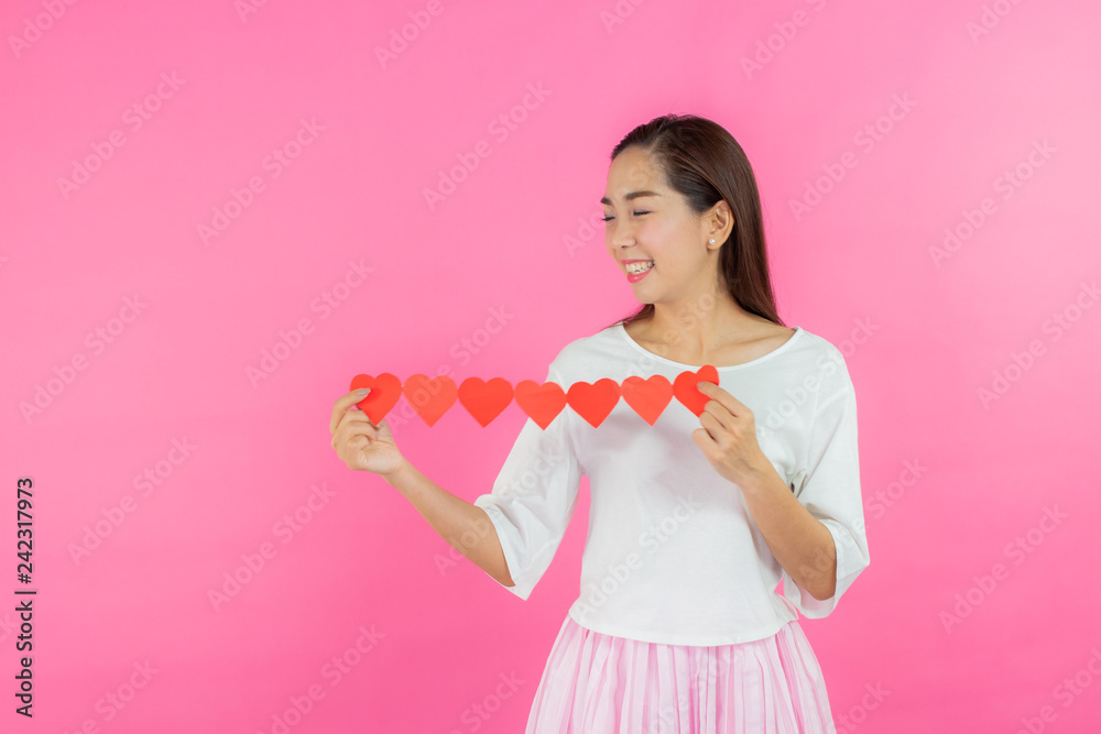 valentine day concept. Beautiful smiley asia girl with pink background copy space isolated. valentine day concept. Beautiful smiley asia girl with pink background copy space isolated.