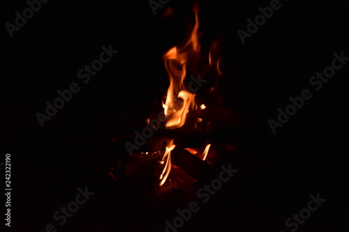 burning candle on black background © Pai