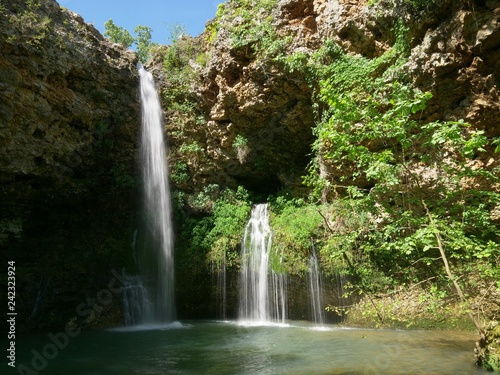 Fototapeta Naklejka Na Ścianę i Meble -  Beautiful 77-foot waterfalls at the Natural Falls State Park, West Siloam Springs, Oklahoma