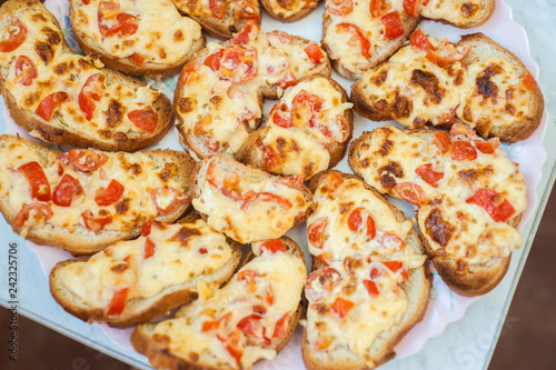 sandwiches with melted cheese and tomatoes