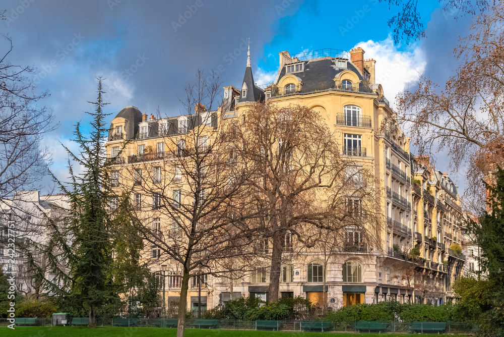 Paris, beautiful building in winter, typical parisian facade in the Marais, view from the square du Temple 