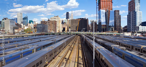 Panoramic view of Hudson Yards train station with the Midtown Manhattan skyline in the background taken from the High Line Park in New York City