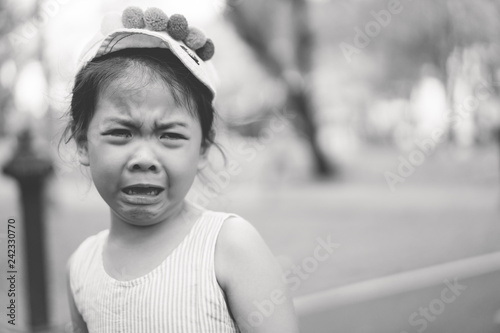 4 years old little girl.Crying little girl on street.Little asian girl fall on street and crying.Accident on street concept.