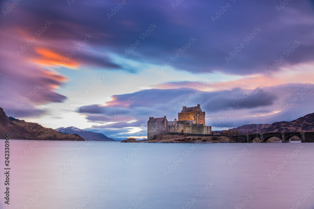 Eilean Donan Castle in The Highlands of Scotland on the way to the Isle of Skye - sunset scenery