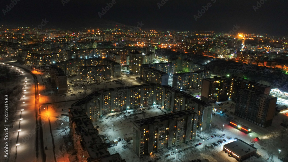 Night city with lot of houses and buildings , areal shoot , drone capture 