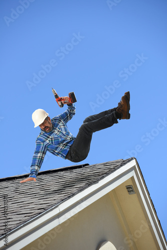 Construction worker falling off the roof
